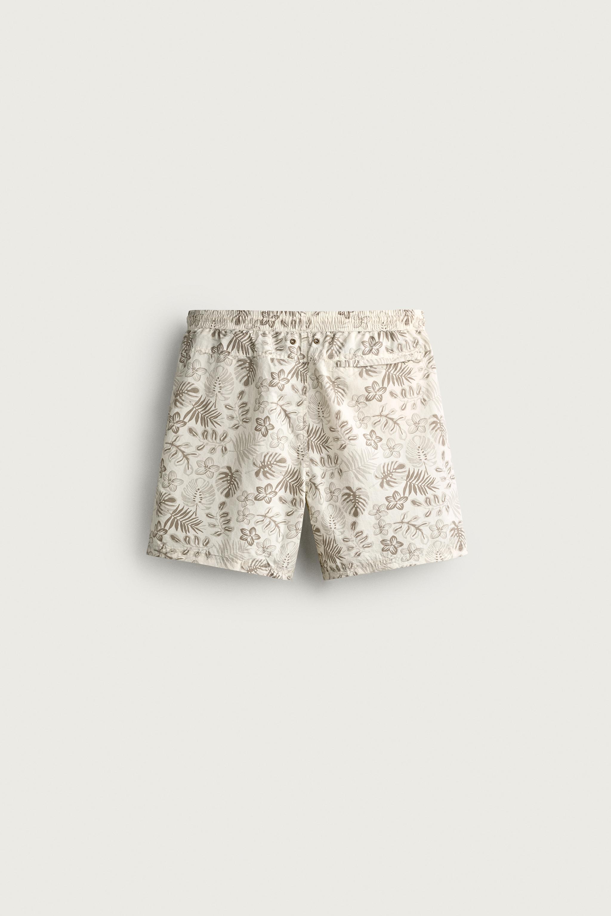 LONG FLORAL PRINT SWIM SHORTS